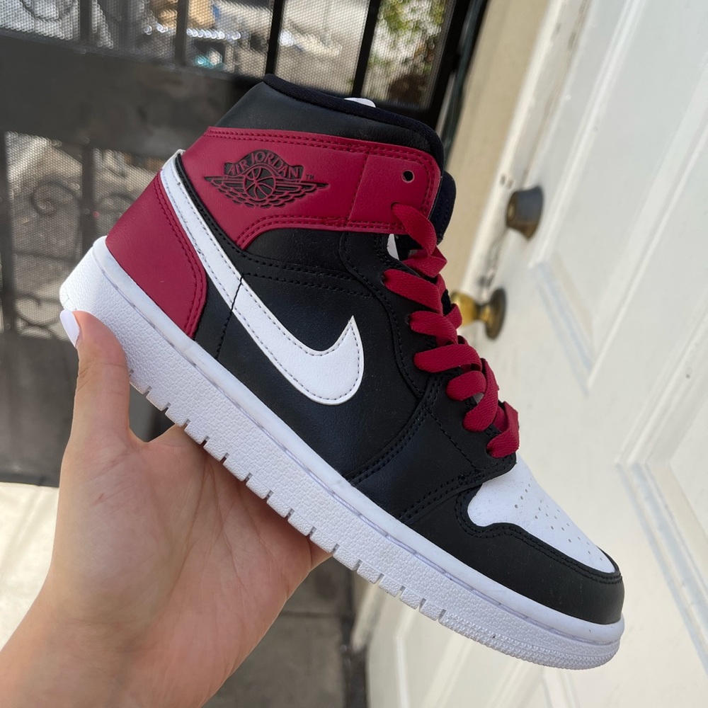 Nike women’s Air Jordan 1 mid size 7 in black, white & noble red